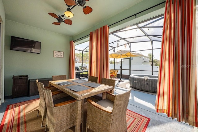 dining space with a sunroom and ceiling fan