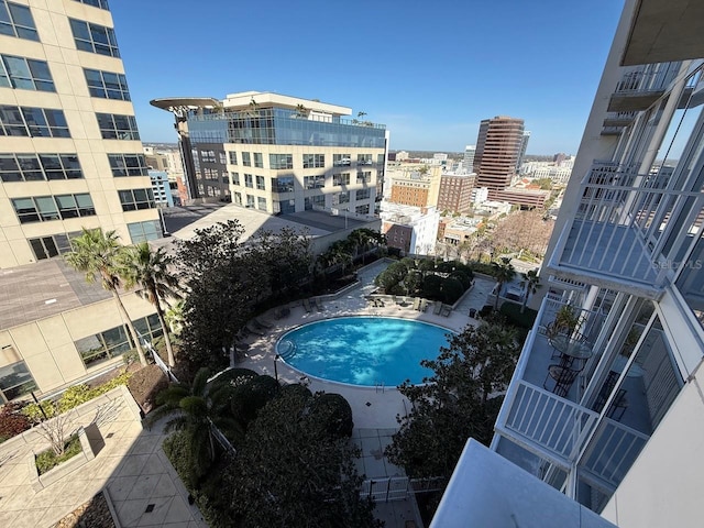 view of pool with a city view