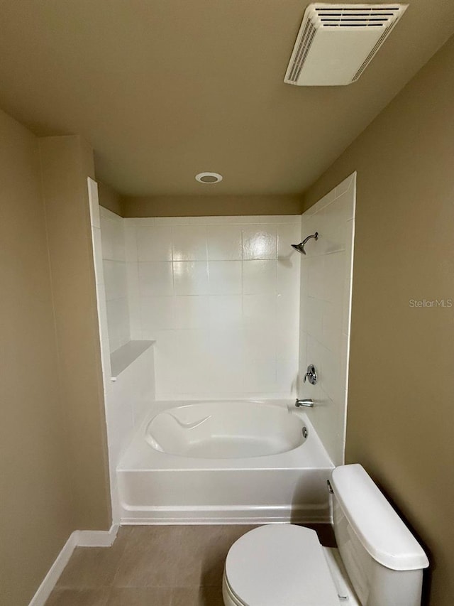 full bath featuring tile patterned flooring, toilet, visible vents, baseboards, and tub / shower combination