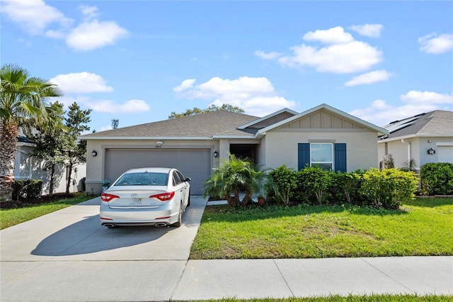 ranch-style house with stucco siding, an attached garage, board and batten siding, a front yard, and driveway