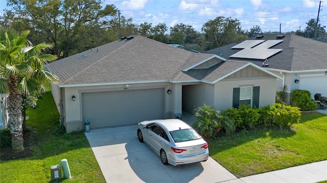 single story home with a garage, roof with shingles, driveway, and a front lawn