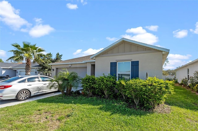 view of front facade with a garage, a front lawn, board and batten siding, and stucco siding