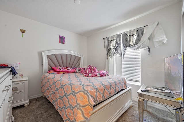 bedroom featuring carpet flooring and baseboards