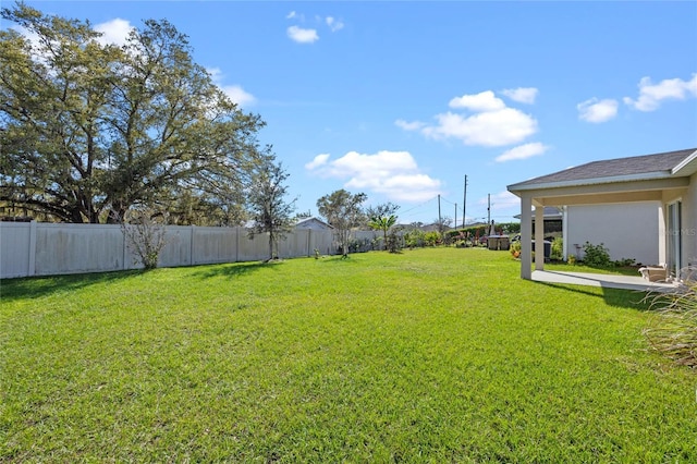 view of yard featuring fence