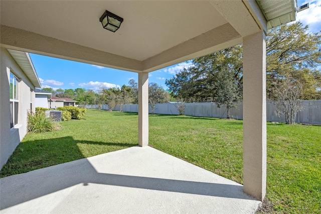 view of yard featuring a patio area and a fenced backyard