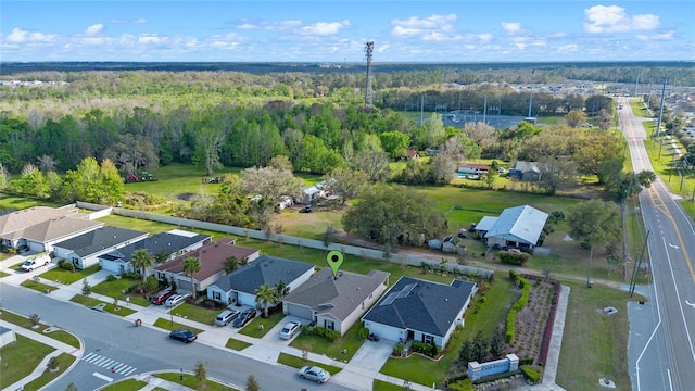 bird's eye view with a residential view and a view of trees