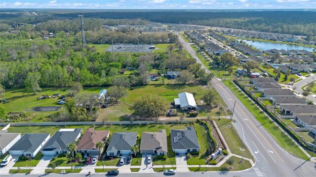 bird's eye view featuring a residential view and a water view