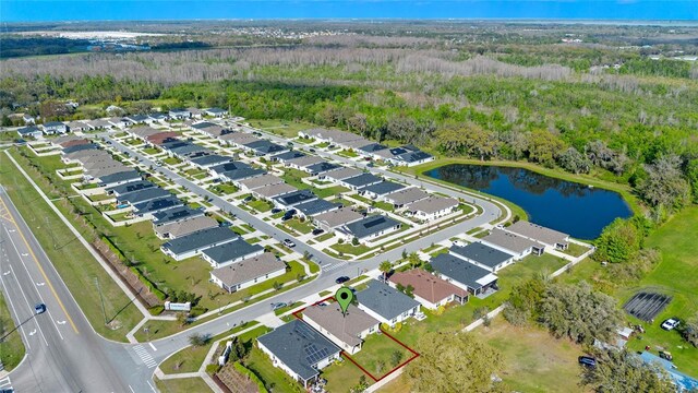 birds eye view of property featuring a water view and a residential view