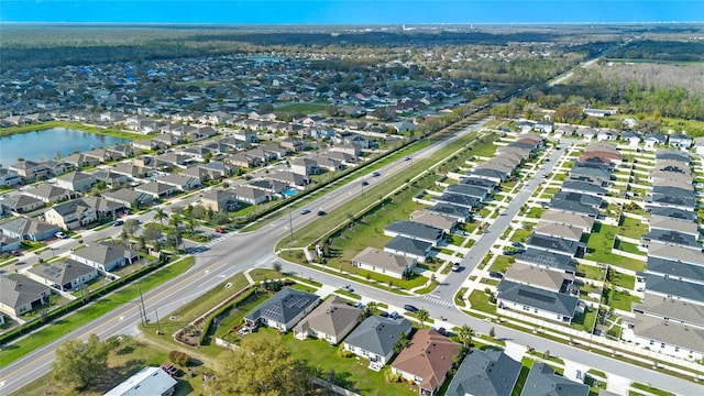 aerial view with a residential view and a water view