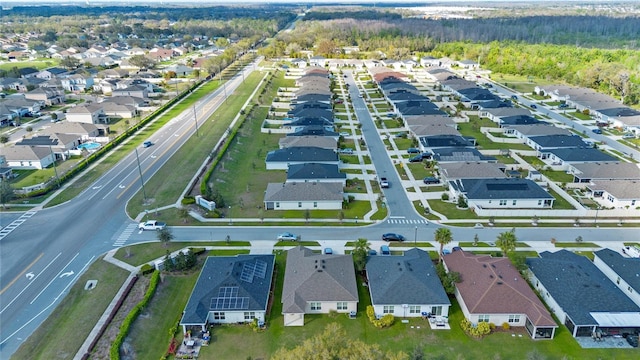 birds eye view of property with a residential view