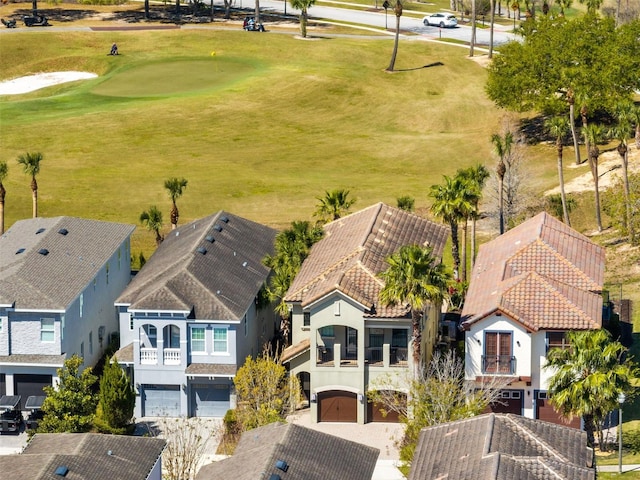 birds eye view of property with view of golf course