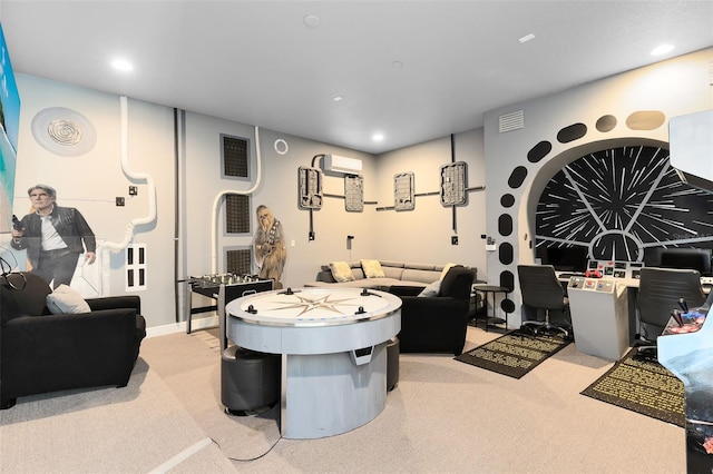 recreation room with recessed lighting, visible vents, light colored carpet, and an AC wall unit