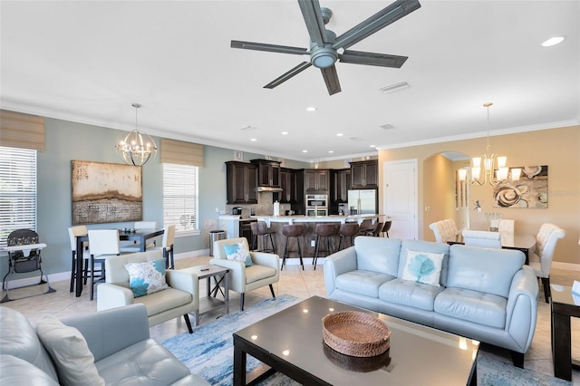 living room featuring crown molding, light tile patterned floors, and arched walkways