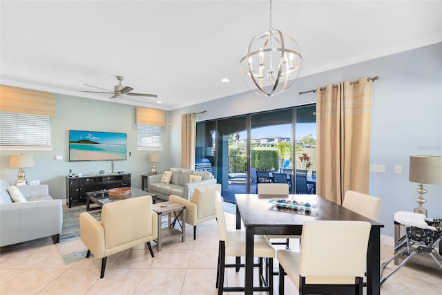 dining area with light tile patterned floors, ceiling fan with notable chandelier, recessed lighting, and ornamental molding