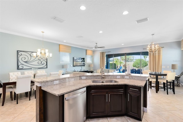 kitchen with dishwasher, hanging light fixtures, light tile patterned floors, and a sink