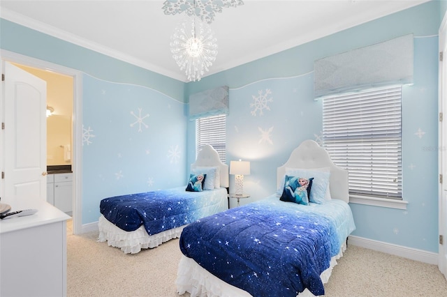 carpeted bedroom featuring baseboards, a notable chandelier, and ensuite bath