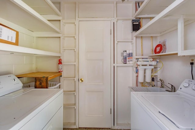 laundry room with laundry area and separate washer and dryer