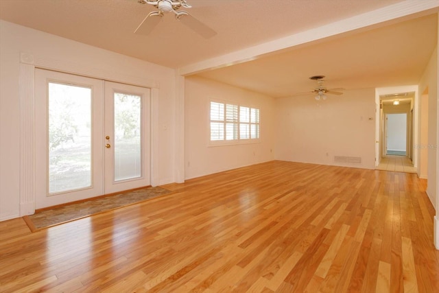 unfurnished room featuring ceiling fan, french doors, visible vents, and light wood-style floors