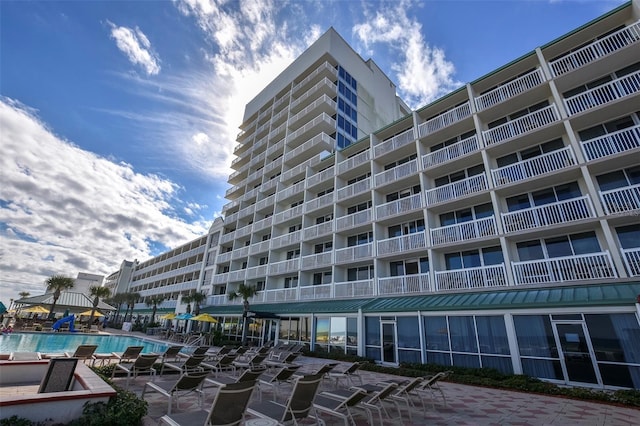 view of property with a community pool