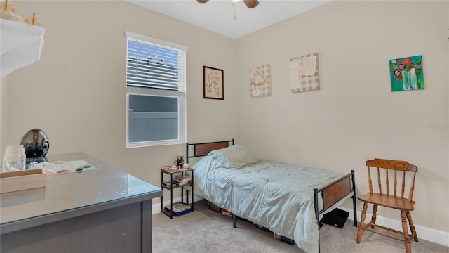 bedroom featuring baseboards, ceiling fan, and carpet flooring