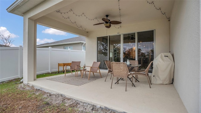 view of patio / terrace featuring a ceiling fan and fence