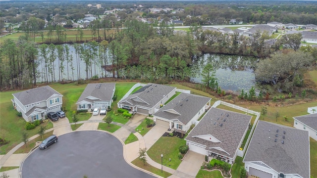 bird's eye view with a residential view and a water view