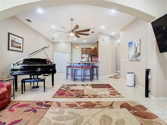 interior space featuring arched walkways, visible vents, recessed lighting, and a ceiling fan