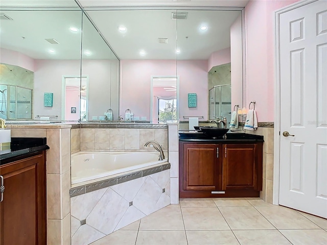 full bathroom featuring vanity, visible vents, a stall shower, tile patterned flooring, and a garden tub