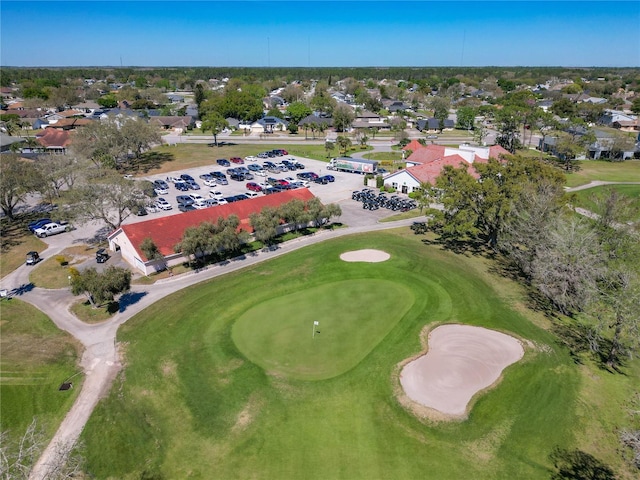 aerial view with view of golf course and a residential view