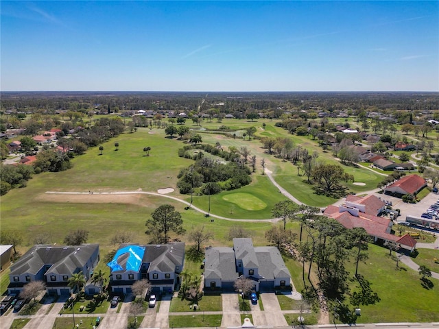 birds eye view of property featuring golf course view and a residential view