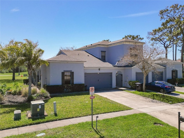 mediterranean / spanish home featuring stucco siding, an attached garage, concrete driveway, and a front lawn