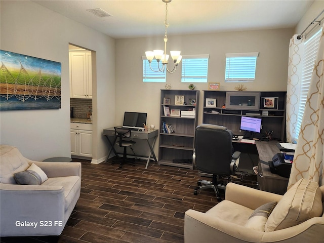 office area featuring visible vents, a notable chandelier, and wood finish floors