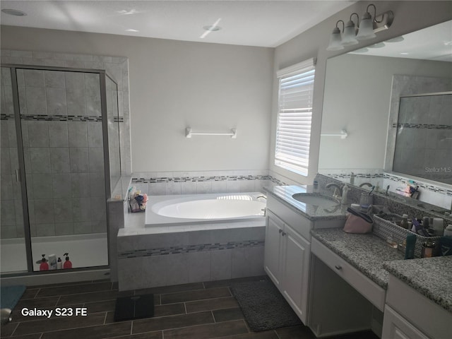 full bath featuring a stall shower, wood tiled floor, a bath, and vanity