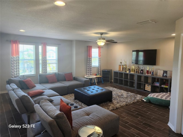 living room with wood finish floors, recessed lighting, visible vents, ceiling fan, and a textured ceiling