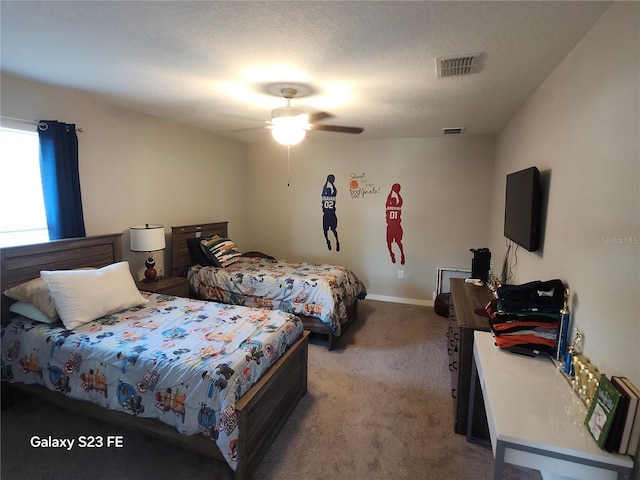 bedroom featuring baseboards, visible vents, a textured ceiling, and light colored carpet