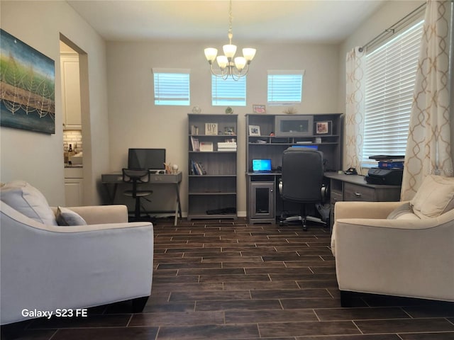 home office with a chandelier, a wealth of natural light, and wood finish floors