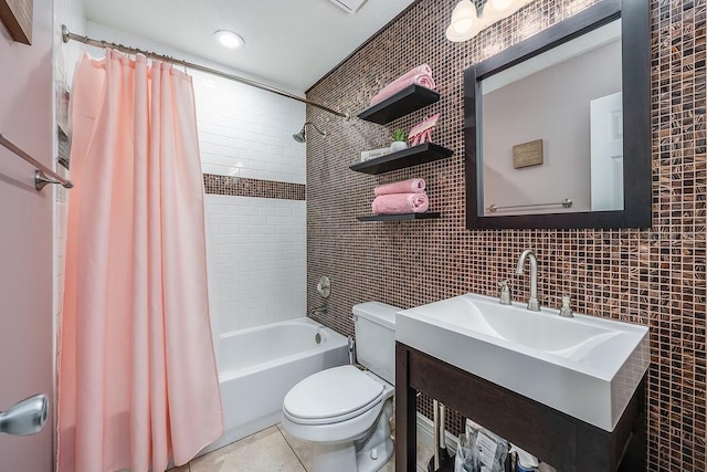 full bathroom featuring tile patterned flooring, toilet, vanity, tile walls, and shower / bath combination with curtain