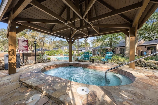 view of pool featuring a patio area and a gazebo