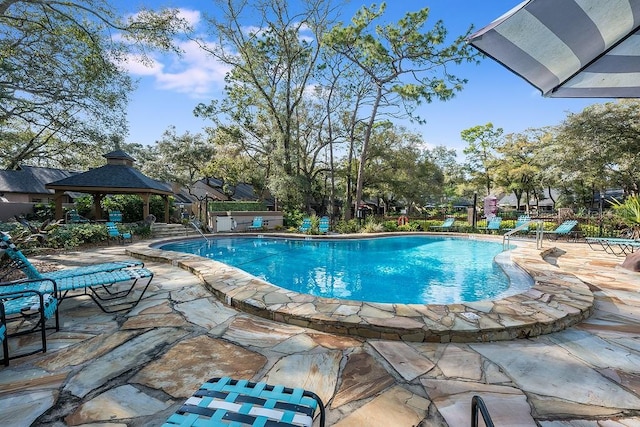 community pool featuring a patio area and a gazebo