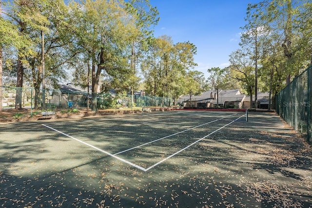 view of tennis court with fence