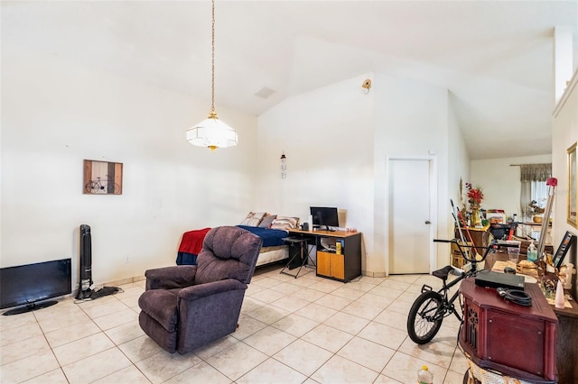 interior space with light tile patterned flooring and high vaulted ceiling