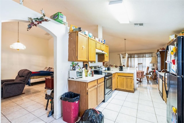 kitchen featuring visible vents, freestanding refrigerator, a peninsula, light countertops, and stainless steel electric range oven