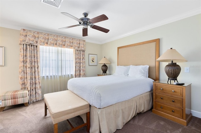 carpeted bedroom featuring visible vents, baseboards, crown molding, and ceiling fan