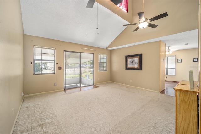 unfurnished living room featuring baseboards, carpet, and ceiling fan