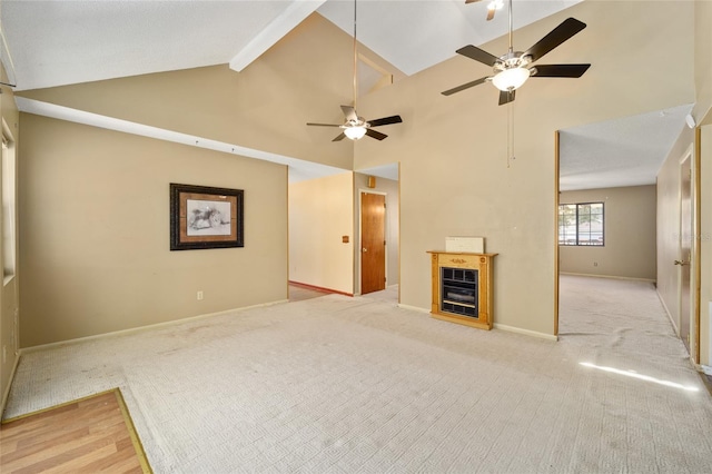 unfurnished living room featuring baseboards, carpet, beam ceiling, high vaulted ceiling, and a ceiling fan