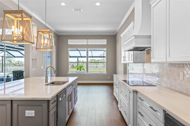 kitchen with dishwasher, custom range hood, ornamental molding, black electric cooktop, and a sink