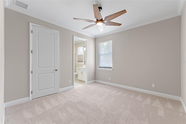 unfurnished bedroom featuring ornamental molding, light carpet, visible vents, and baseboards