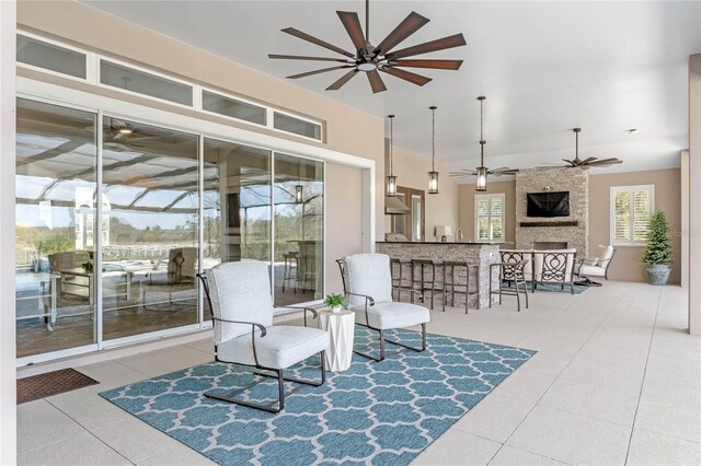 view of patio with a ceiling fan and outdoor wet bar