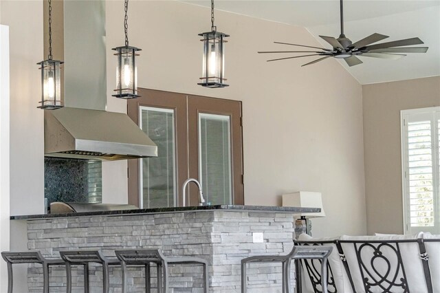 view of patio / terrace with ceiling fan, a sink, and outdoor wet bar