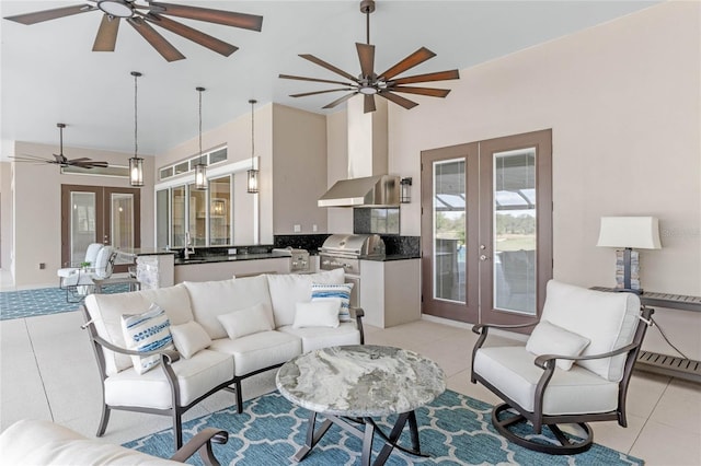 living area featuring light tile patterned flooring, a ceiling fan, and french doors